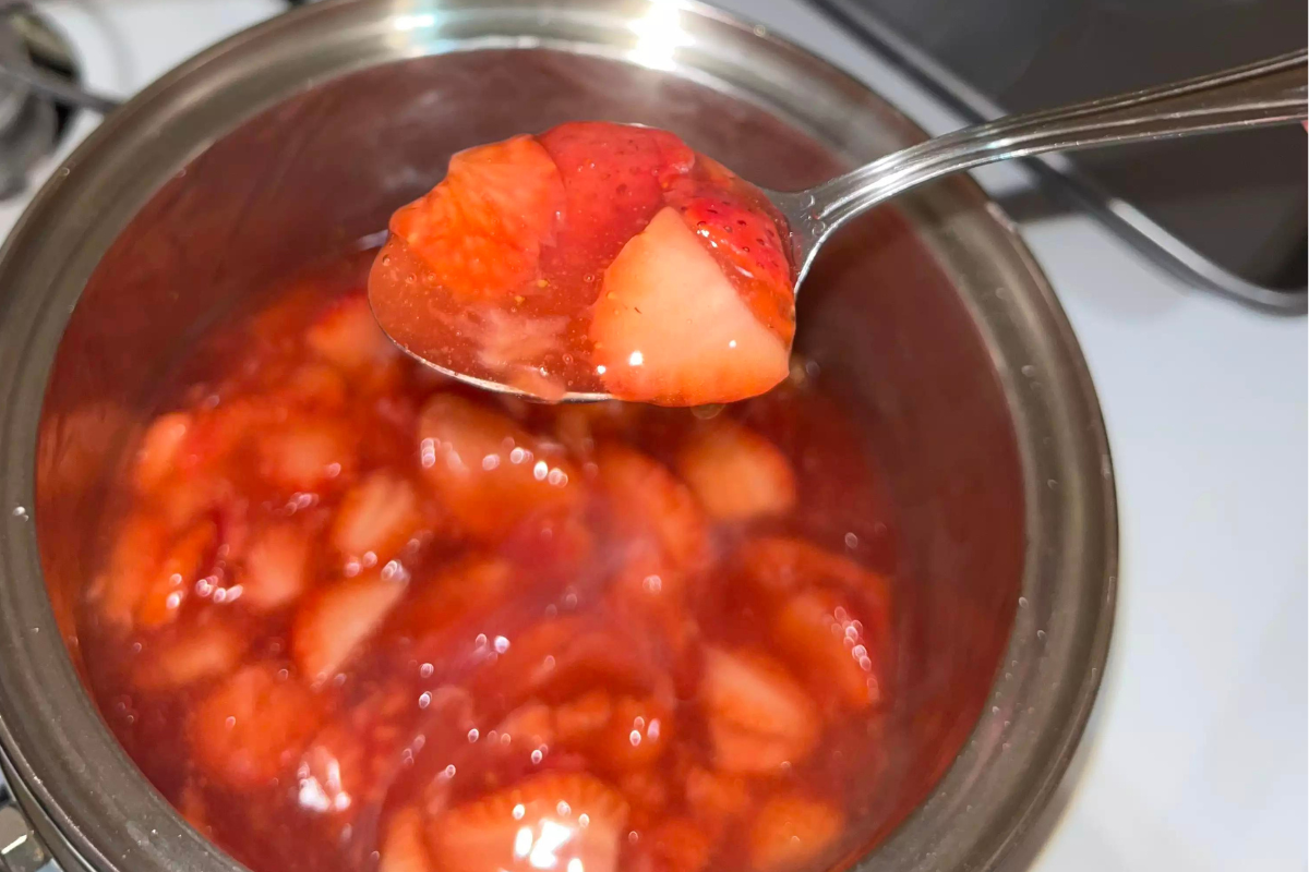 Close-up of strawberry filling being prepared in a saucepan