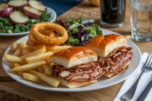 Philly cheesesteak sliders with fries, onion rings, kale salad, and roasted potatoes