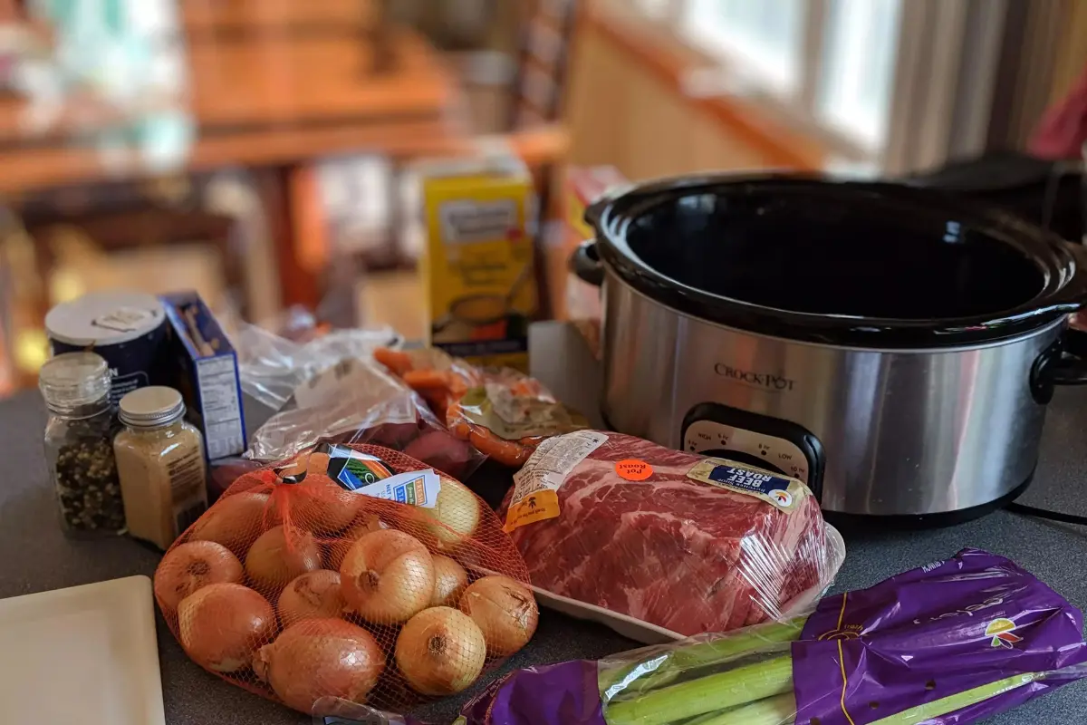 Creamy mashed potatoes and cheesy potatoes cooked in a crockpot.