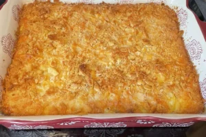 Southern squash casserole with a golden, crunchy topping in a rustic dish.