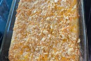 Southern squash casserole with a golden, crunchy topping in a rustic dish.