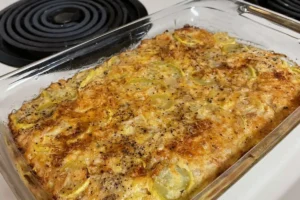 Southern squash casserole with a golden, crunchy topping in a rustic dish.