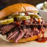 Juicy brisket sandwich on a toasted bun with BBQ sauce and coleslaw